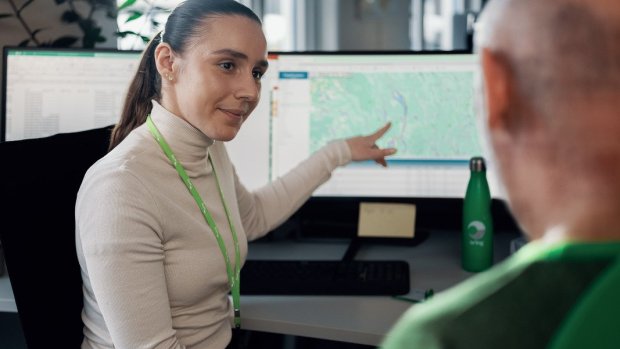 Bring employee in conversation with woman at the office
