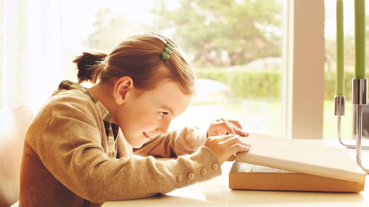 Child opening parcel